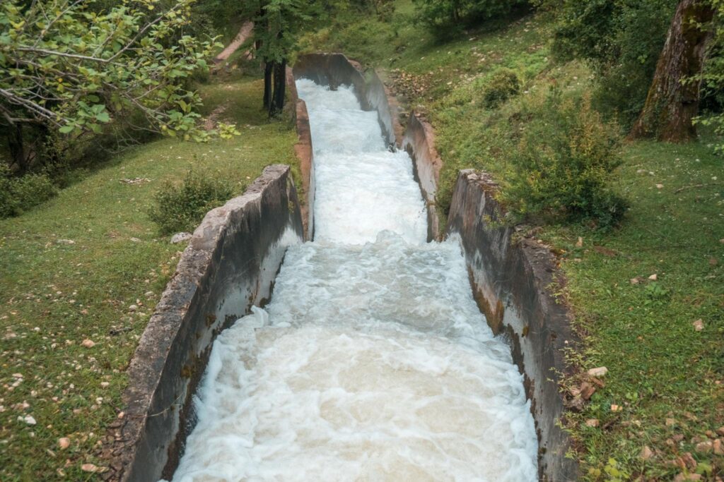  Concrete chute structure carrying stormwater through an urban drainage channel designed for water flow control and erosion reduction