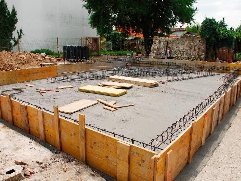 Concrete slab foundation with reinforced footings illustrating common foundation types used in civil engineering.