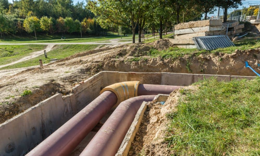 Underground utility trench showing separated parallel pipelines for water and sewer lines