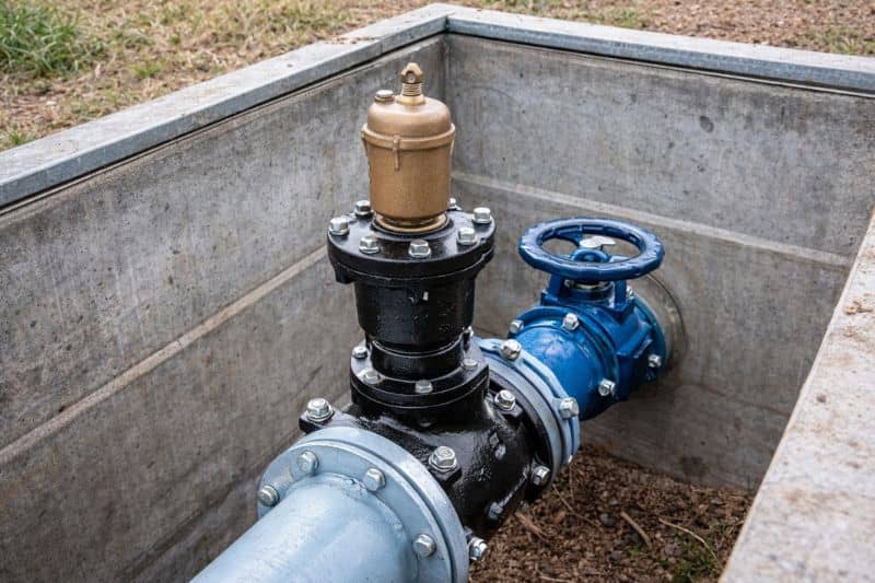 Air release valve assembly installed at a high point on a municipal water distribution line inside a valve vault