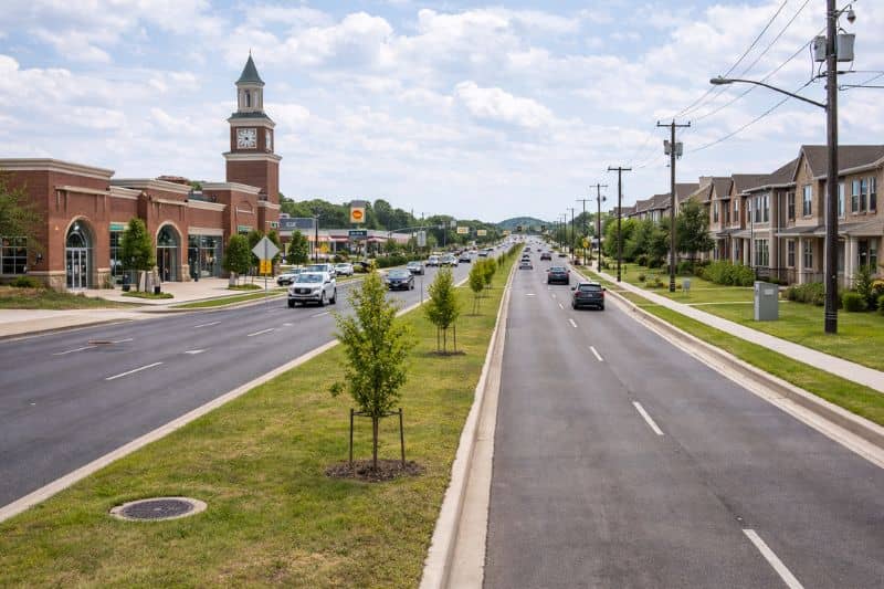 Multi lane roadway with mixed use development in Denton Texas reflecting rapid population growth and infrastructure expansion